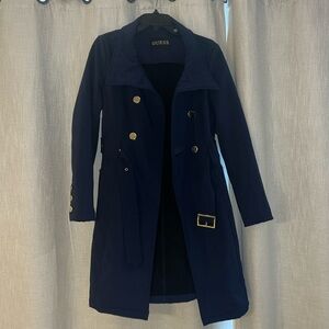 Navy blue belted trench coat with silver buttons and zippers by Guess.